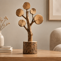 AVOLTT wood slice tree sculpture with five round wood slices and a bark-edged base in a living room