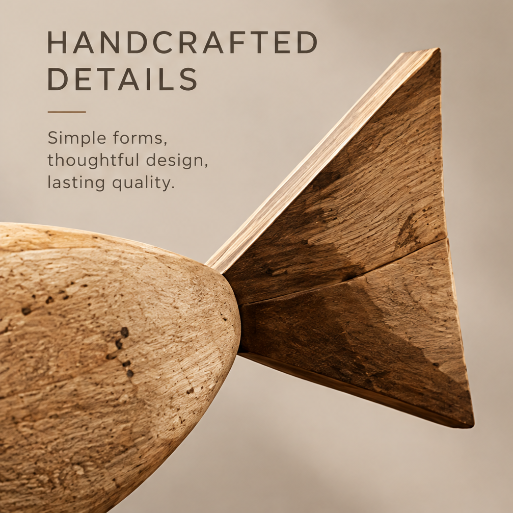 Close-up of the fish sculpture's triangular wooden tail and textured body