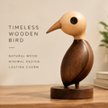 AVOLTT two-tone wooden bird sculpture with a light head, brown body, and round base on a tabletop