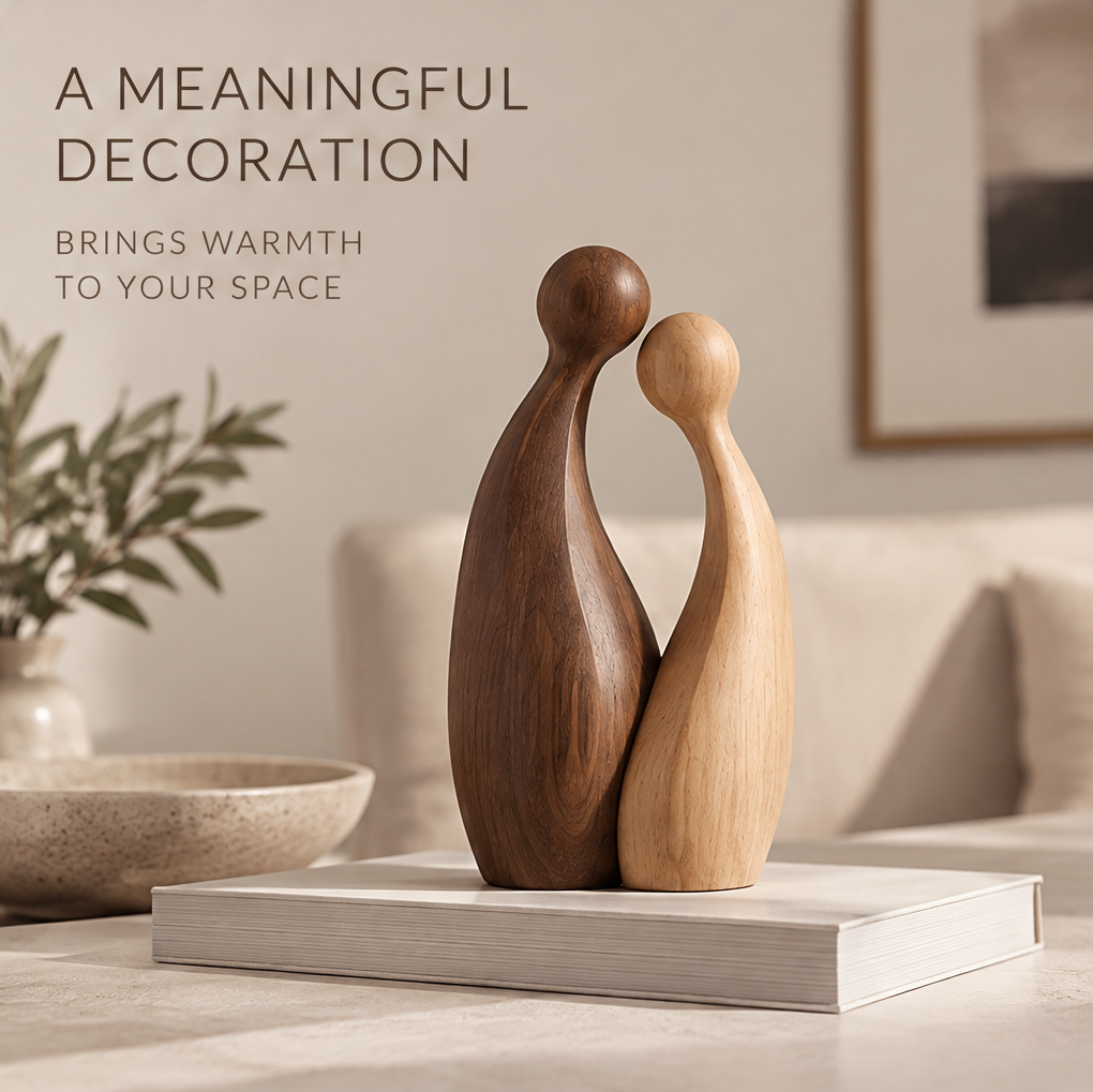 Abstract couple wood sculpture displayed on a book in a warm neutral living room